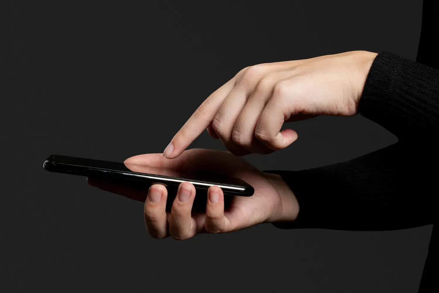 Finger pressing smartphone screen